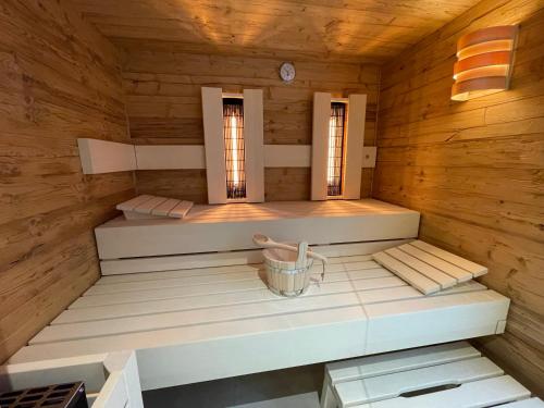 an inside view of a wooden room with a sauna at Alpenchalet Iseler in Oberjoch