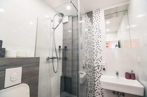 Ванная комната в The Place Apartments Hebrangova
