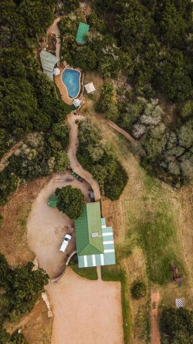 an aerial view of a house and a swimming pool at Thunzi Bush Lodge in Beachview