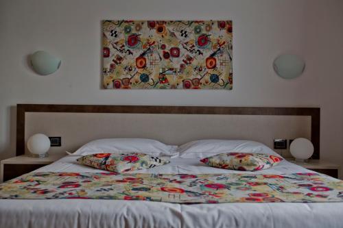 Postel nebo postele na pokoji v ubytování Hotel Lago di Como