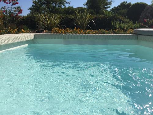 a pool of water with a blue sky at Bouganville B&B in Cefalù