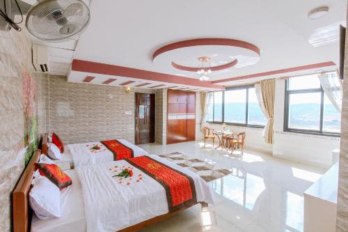 Postel nebo postele na pokoji v ubytování Sai Gon Dak Nong Hotel