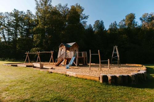 a park with a playground with a play set at Hotel Le Val D'arimont in Malmedy