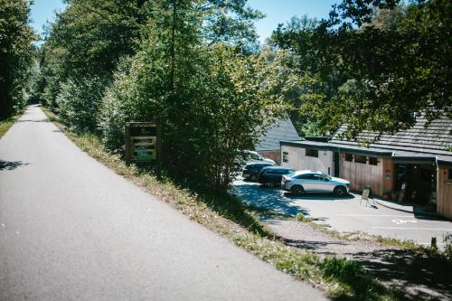 a street with cars parked in a parking lot at Hotel Le Val D'arimont in Malmedy