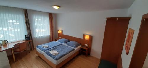 Un pat sau paturi într-o cameră la Schillers Landhaus