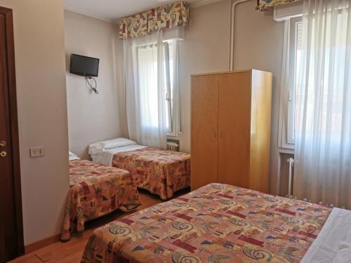 Lova arba lovos apgyvendinimo įstaigoje Hotel Montepiana