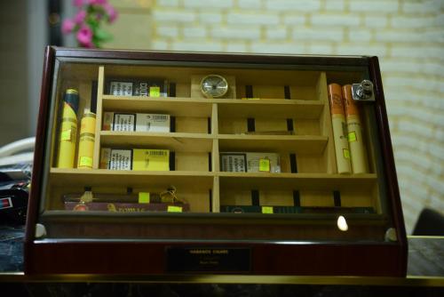 a briefcase filled with books on a table at Hotel Comfort in Tirana