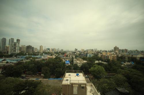a view of a city with buildings and trees at The Byke Delotel in Mumbai