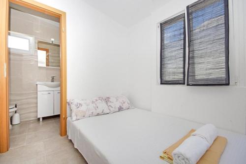 מיטה או מיטות בחדר ב-Apartman Plaža