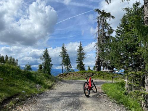 a bike is parked on a dirt road at Hotel Berghof in Sonnenalpe Nassfeld