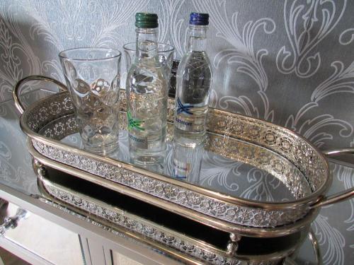 a metal tray with bottles and glasses on it at Willow Lodge Hambleton in Poulton le Fylde