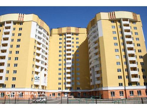 two large apartment buildings with balconies on them at Современная квартира в новом комплексе возле Днепра in Cherkasy