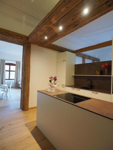 a kitchen with a large island in a room at Innviertler Versailles in Aurolzmünster