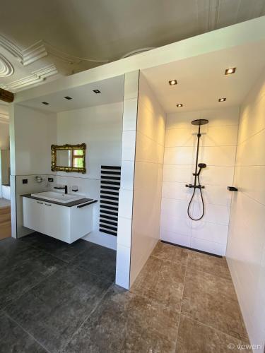 a bathroom with a sink and a mirror at Innviertler Versailles in Aurolzmünster