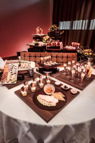 a table with a buffet of food and drinks at Hotel Ambassador in Bern