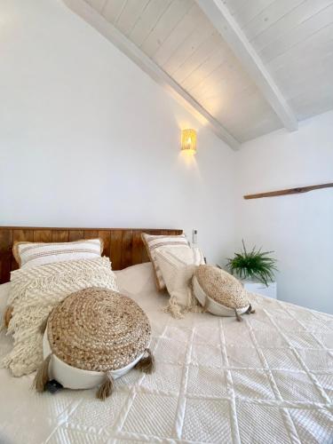 a bedroom with two large tortoise pillows on a bed at B&B Anastasia in Santa Teresa Gallura