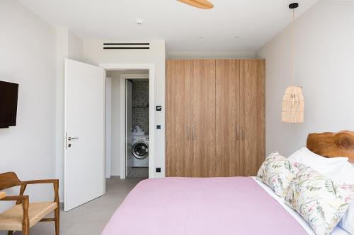 Postel nebo postele na pokoji v ubytování paleo villas