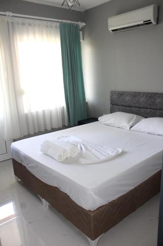 Ένα ή περισσότερα κρεβάτια σε δωμάτιο στο Alpat Homes