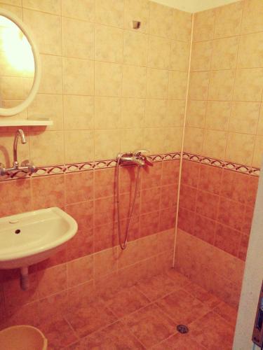 a bathroom with a shower and a sink at Къща за гости Синьо Лято in Pomorie