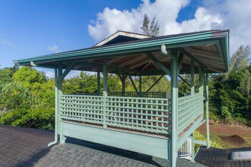 a gazebo with a roof on top of it at Hale Ki'i Maka Manu home in Keaau