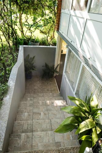 a staircase leading up to a building with plants at Ruralna kuća za odmor LOVRAK in Budrovac