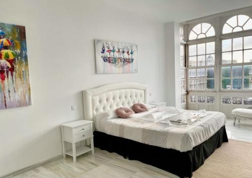 Postel nebo postele na pokoji v ubytování Apartamento María Pita