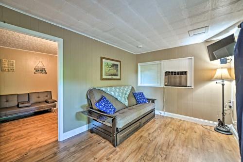 a living room with a couch and a table at Lake Barkley Home Private Dock, Kayaks, Fire Pit! in Cadiz