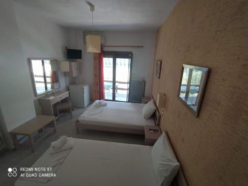 プテリオスにあるSalonikiosのベッド2台が備わる部屋