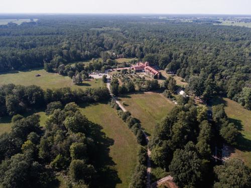 an aerial view of a house in a field at Waldhotel Eiche in Burg