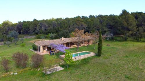 an aerial view of a house with a swimming pool at 4 bedrooms villa with private pool enclosed garden and wifi at Camallera in Camallera