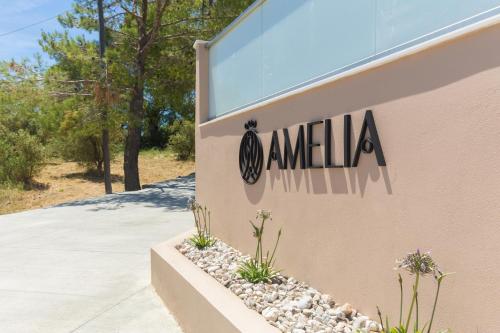 a sign on the side of a building at Amelia Residence in Tragaki