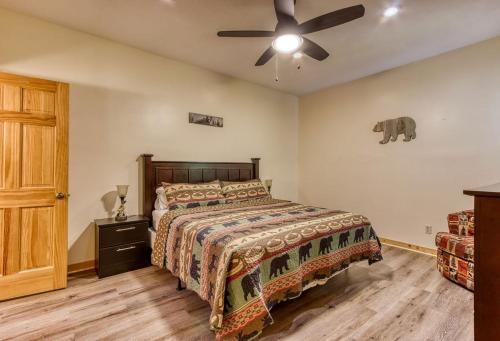 a bedroom with a bed and a ceiling fan at City View Chalet, City View Chalet, Pool Table, Hot Tub, WIFI, Free Attraction Tickets!!! in Gatlinburg