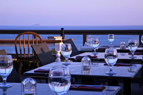 a table with wine glasses on top of a balcony at HOTEL BRONTE in Istanbul