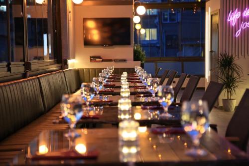 a long table in a restaurant with glasses on it at HOTEL BRONTE in Istanbul