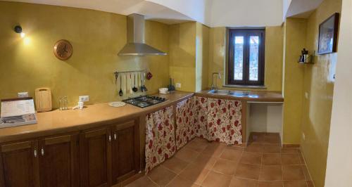 a kitchen with a sink and a counter top at Il dammuso di Giorgia in Pantelleria