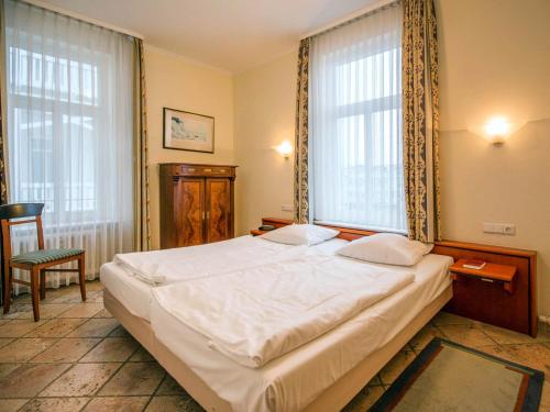 Ένα ή περισσότερα κρεβάτια σε δωμάτιο στο Strandvillen Binz - Ferienwohnung mit Meerblick und 1 Schlafzimmer SV-705