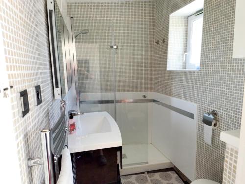 a bathroom with a shower and a sink and a tub at Maison cosy à La Tranche-sur-Mer - 45 m² avec jardin in La Tranche-sur-Mer
