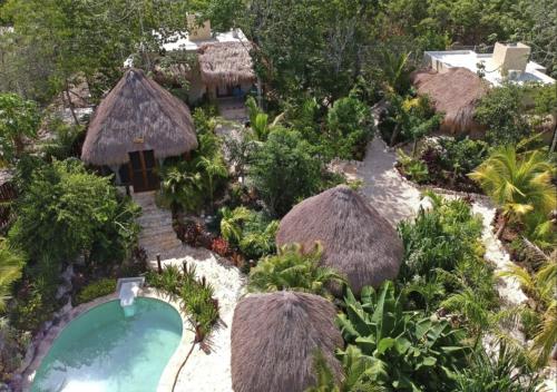 an aerial view of a resort with a swimming pool at ALDEA JO-YAH in Tulum