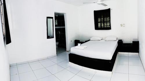 Кровать или кровати в номере Hotel Punto4