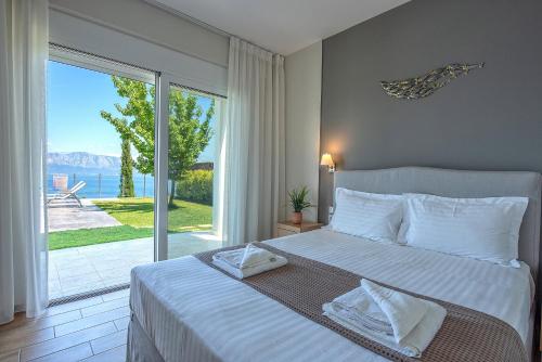 Кровать или кровати в номере Ionian Heaven Villas