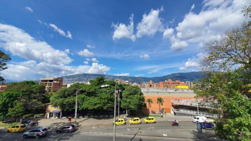 a group of cars parked in a parking lot at Hostel Boutique Nido de Loros in Medellín