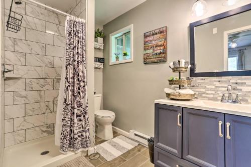 a bathroom with a shower and a sink and a toilet at Deck and Pool Access Welcoming Poconos Retreat in Tobyhanna