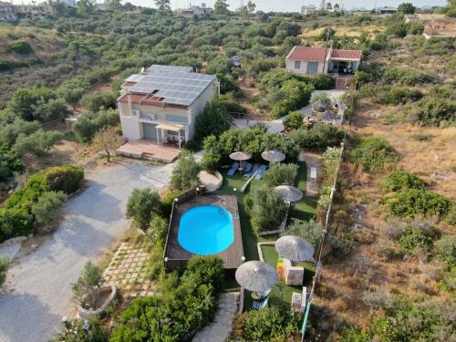 an aerial view of a house with a swimming pool at Ktima Nikolaos in Arónion