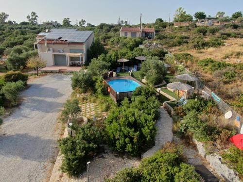 an aerial view of a house with a swimming pool at Ktima Nikolaos in Arónion