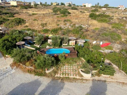 an aerial view of a house with a pool at Ktima Nikolaos in Arónion