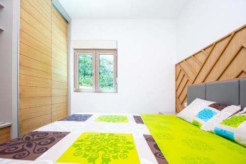 Postel nebo postele na pokoji v ubytování Apartman DULY LUX