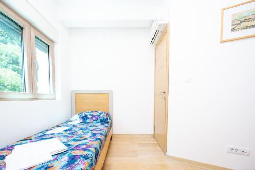Postel nebo postele na pokoji v ubytování Apartman DULY LUX