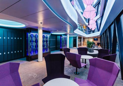 a meeting room with purple chairs and a table at Viking Line ferry Viking Grace - Mini-cruise from Turku in Turku