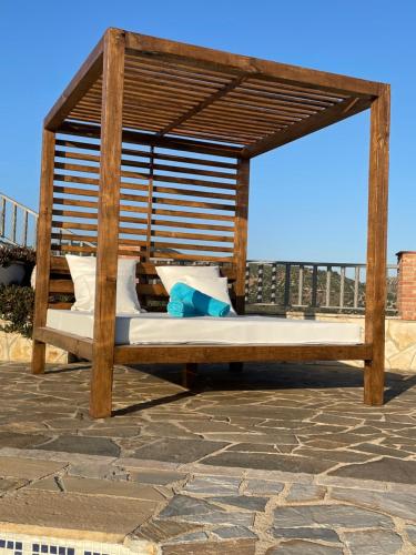 a wooden gazebo sitting on a patio at El Mirador in Iznájar
