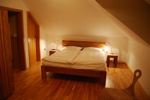 a bedroom with a bed with a wooden headboard at Obora 824 in Nová Bystřice